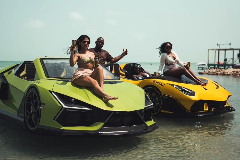 Guests gathered with the green and yellow jet cars at Secret Beach